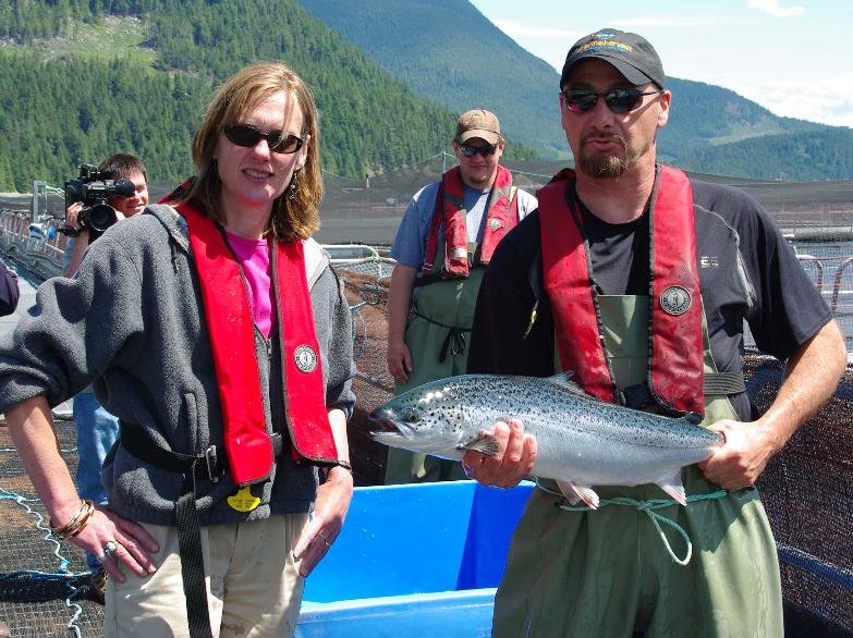 Claire Trevena Marine Harvest visit photo with salmon Claire Trevena Marine Harvest visit photo with salmon