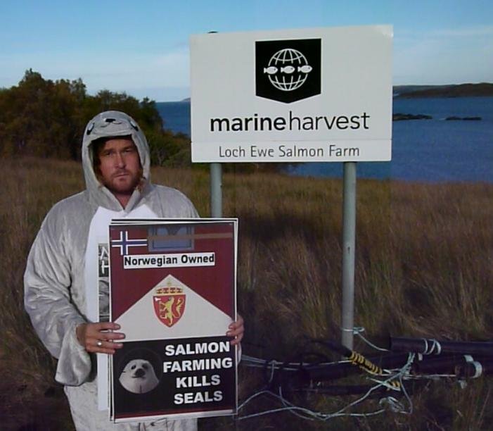 Photo #2 Don at MH Loch Ewe with Salmon Farming Kills Seals sign Photo #2 Don at MH Loch Ewe with Salmon Farming Kills Seals sign