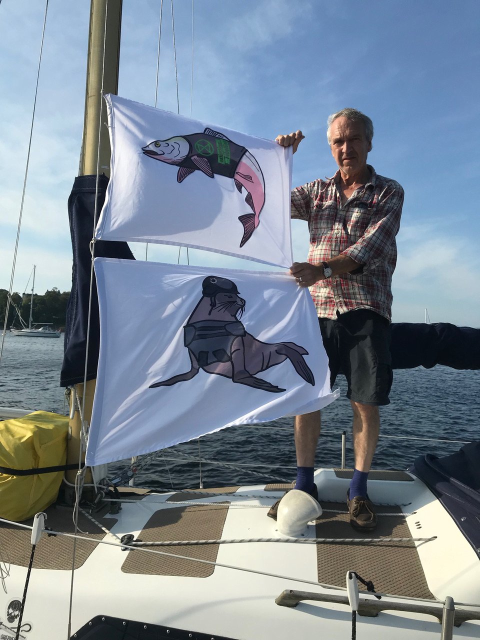 Flags on boat Salmon & Seal with Andrew holding Flags on boat Salmon & Seal with Andrew holding